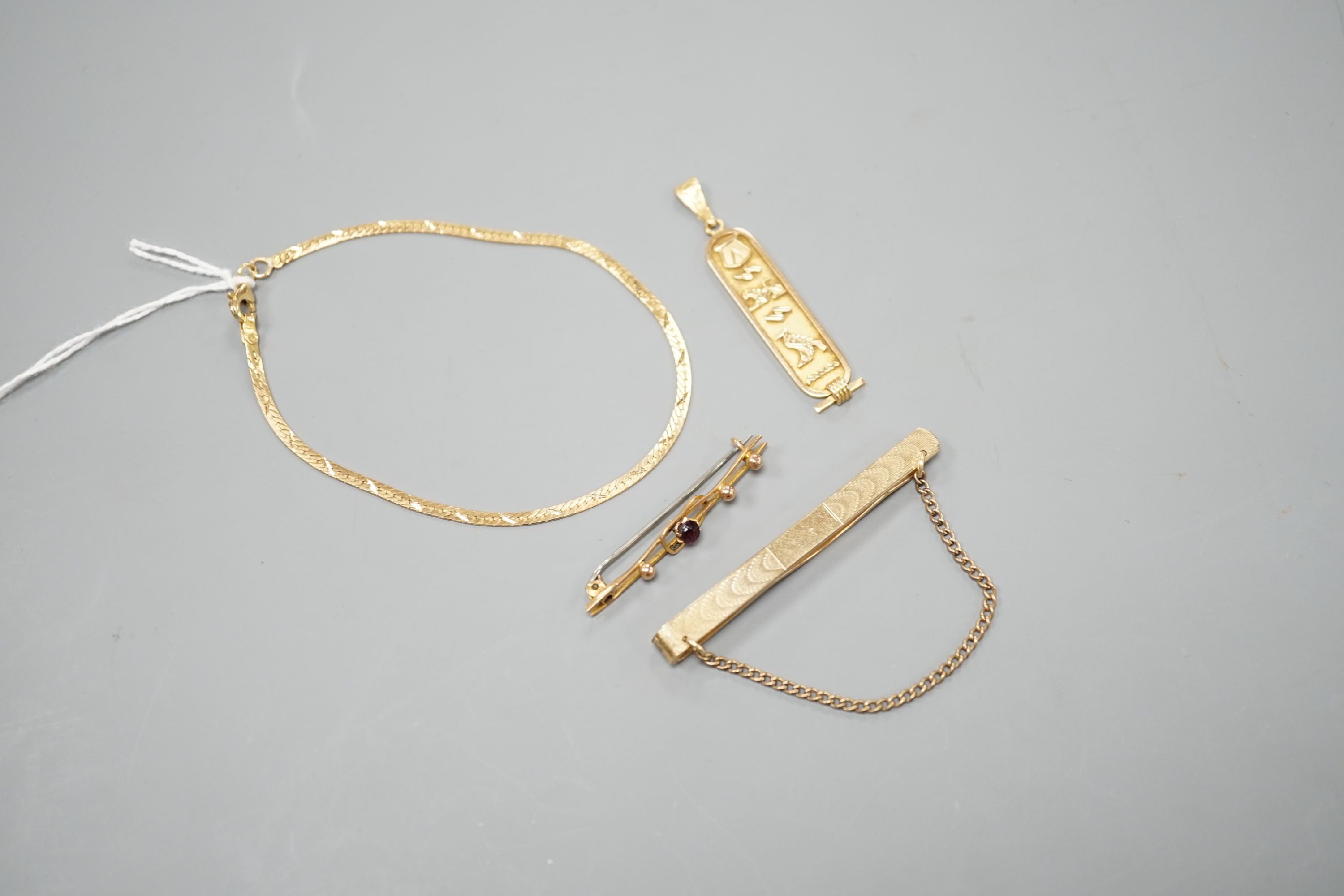 A Middle Eastern pendant and bracelet, gross 6.5 grams, together with a 9ct bar brooch and a rolled gold tie clip.